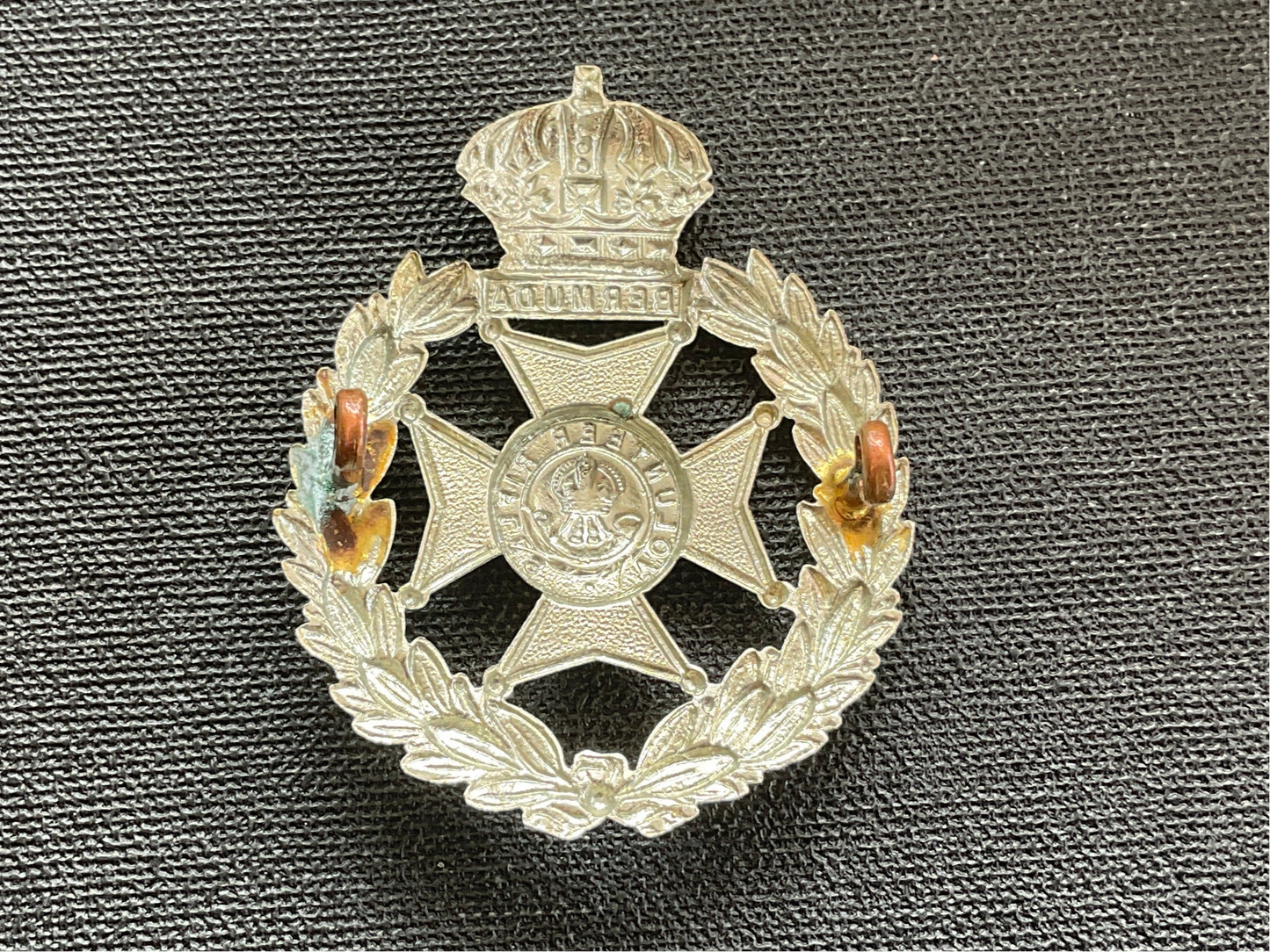 Bermuda Volunteers cap badge.