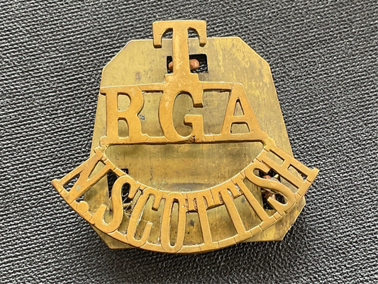 WW1 T/RGA/N.SCOTTISH brass shoulder title.
